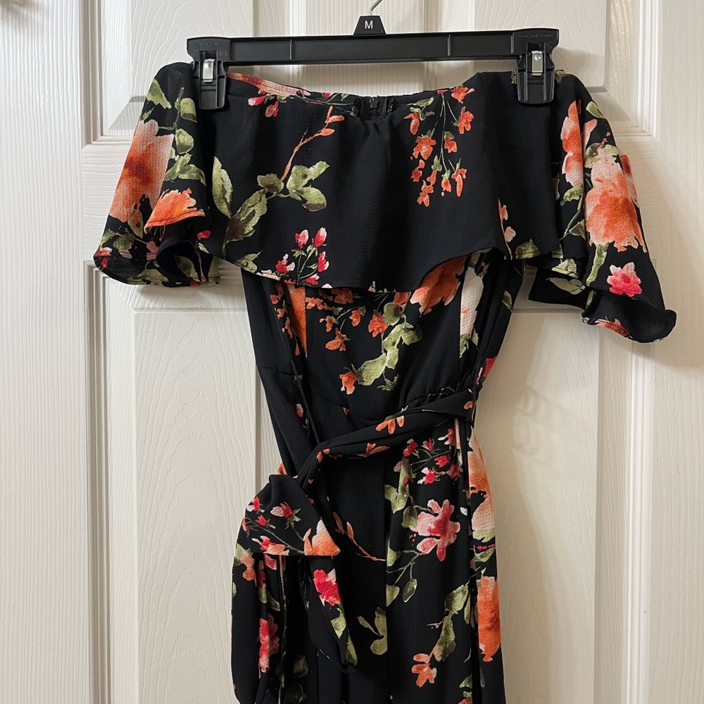 BLACK JUMPSUIT WITH WHITE / RED FLOWERS AND TIE BELT
